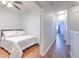 Bedroom with hardwood floors and access to hallway at 3456 High Hampton Cir, Tampa, FL 33610