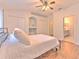 Comfortable bedroom featuring hardwood floors and access to en-suite bathroom at 3456 High Hampton Cir, Tampa, FL 33610