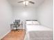 Simple bedroom setup with a desk, bed, and chair, ideal for study or relaxation at 3456 High Hampton Cir, Tampa, FL 33610