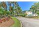 Scenic entrance to Williams Crossing with lush landscaping and community signage at 3456 High Hampton Cir, Tampa, FL 33610