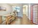 Open dining area with wood-look floors, chandelier, and sightlines to the kitchen at 3456 High Hampton Cir, Tampa, FL 33610