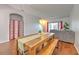 Cozy dining space with hardwood floors and access to the living room at 3456 High Hampton Cir, Tampa, FL 33610