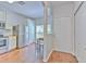 Efficient kitchen featuring stainless steel appliances and wood-look flooring at 3456 High Hampton Cir, Tampa, FL 33610