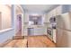 Open kitchen with stainless steel appliances and views into the dining area at 3456 High Hampton Cir, Tampa, FL 33610