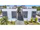 Aerial view of modern townhomes with lush landscaping and brick paver driveway at 4215 W North A St # 3, Tampa, FL 33609