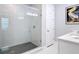 Bright bathroom features a glass enclosed shower and a white vanity with a stone countertop at 4215 W North A St # 3, Tampa, FL 33609