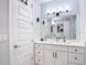 Bright bathroom with a double sink vanity, matte black hardware, and a large mirror at 4215 W North A St # 3, Tampa, FL 33609