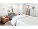 This bright bedroom showcases a dresser, accent chair, and doorway leading to another area at 4215 W North A St # 3, Tampa, FL 33609