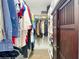 A functional walk-in closet with custom shelves, hanging racks, and wooden doors for efficient storage at 4215 W North A St # 3, Tampa, FL 33609