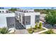 Modern townhome features an inviting exterior with gray accents, brick driveway and green landscaping at 4215 W North A St # 3, Tampa, FL 33609