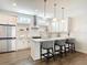 Bright kitchen features white cabinets, stainless steel appliances, and a center island with bar seating at 4215 W North A St # 3, Tampa, FL 33609
