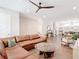 Spacious living room featuring a brown leather sectional sofa and unique wood base coffee table at 4215 W North A St # 3, Tampa, FL 33609