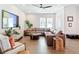 Inviting living room with hardwood floors, ceiling fan, and modern furnishings, creating a comfortable space at 4215 W North A St # 3, Tampa, FL 33609