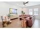 Cozy living room with hardwood floors, ceiling fan, and ample seating, perfect for relaxation at 4215 W North A St # 3, Tampa, FL 33609