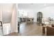 Open-concept living space featuring a dining area, kitchen, modern decor, and hardwood floors at 4215 W North A St # 3, Tampa, FL 33609