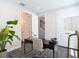 Home office with geometric floors, modern lighting and an open doorway to stairs at 4215 W North A St # 3, Tampa, FL 33609