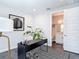 Home office with adjacent bathroom, featuring geometric floors, modern lighting, and neutral décor at 4215 W North A St # 3, Tampa, FL 33609