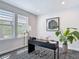 Stylish home office with geometric floors, large windows, modern lighting, and a sleek black desk at 4215 W North A St # 3, Tampa, FL 33609