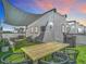Enjoy outdoor living on this rooftop deck with a dining area, lounge, and awning for shade at 4215 W North A St # 3, Tampa, FL 33609