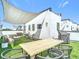 Rooftop patio features ample seating, a shade and a Traeger smoker for outdoor entertaining at 4215 W North A St # 3, Tampa, FL 33609