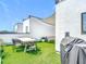 Relax on this rooftop deck with a dining table, grill, and comfortable seating area at 4215 W North A St # 3, Tampa, FL 33609