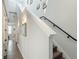 Elegant staircase with white trim and modern lighting, leading to the upper levels of the home at 4215 W North A St # 3, Tampa, FL 33609