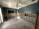 Bedroom undergoing renovation, with wall studs exposed and ceramic tile flooring at 432 51St St W, Palmetto, FL 34221