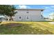 Side yard showing the home's architecture and lawn at 4396 5Th Isle Dr, Hernando Beach, FL 34607
