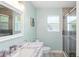 Bathroom featuring granite countertop, tile floors and glass enclosed shower at 4396 5Th Isle Dr, Hernando Beach, FL 34607