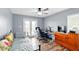 Well-lit bedroom featuring wood floors, desk, and adjacent door to an outdoor balcony at 4396 5Th Isle Dr, Hernando Beach, FL 34607
