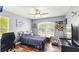 Bedroom featuring a single bed, wood floors, ceiling fan, and lots of natural light at 4396 5Th Isle Dr, Hernando Beach, FL 34607