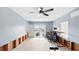 This large flex space has sliding glass doors to a water view, a ceiling fan, and exposed studs at 4396 5Th Isle Dr, Hernando Beach, FL 34607
