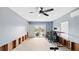 This large flex space has sliding glass doors to a water view, a ceiling fan, and exposed studs at 4396 5Th Isle Dr, Hernando Beach, FL 34607