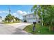 Charming home showcasing the yard, driveway and beautiful architectural design at 4396 5Th Isle Dr, Hernando Beach, FL 34607