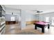 This game room features a billiard table and foosball table, with a modern color scheme at 4396 5Th Isle Dr, Hernando Beach, FL 34607