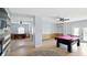 This game room features a billiard table and foosball table, with a modern color scheme at 4396 5Th Isle Dr, Hernando Beach, FL 34607