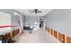 Unfinished garage with exposed studs, a ceiling fan, and a view into the home at 4396 5Th Isle Dr, Hernando Beach, FL 34607