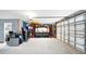 Spacious garage with lots of tools, storage, and an automatic garage door at 4396 5Th Isle Dr, Hernando Beach, FL 34607
