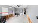 Unfinished garage with exposed studs, a ceiling fan, and a view into the home at 4396 5Th Isle Dr, Hernando Beach, FL 34607