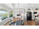 Dining area adjacent to the kitchen with modern appliances, stylish cabinetry, and a view of the water at 4396 5Th Isle Dr, Hernando Beach, FL 34607