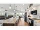 Open concept kitchen with a long island, stainless steel appliances, lots of countertop space, and eat-in breakfast table at 4396 5Th Isle Dr, Hernando Beach, FL 34607