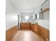 Bright kitchen with white cabinetry, butcher block countertops, and ample storage space at 4396 5Th Isle Dr, Hernando Beach, FL 34607