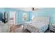 Main bedroom with light blue walls, ceiling fan, and ensuite bathroom with a garden tub at 4396 5Th Isle Dr, Hernando Beach, FL 34607