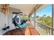 Relaxing covered patio featuring a porch swing and comfortable furniture with views at 4396 5Th Isle Dr, Hernando Beach, FL 34607