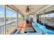 Covered patio with comfortable seating, ceiling fan, and a view of the water at 4396 5Th Isle Dr, Hernando Beach, FL 34607