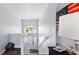 Bright stairway leading to the entrance with a decorative chandelier and a view of the outdoors at 4396 5Th Isle Dr, Hernando Beach, FL 34607