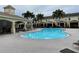 Community pool surrounded by palm trees offering a serene and luxurious outdoor experience at 4624 66Th N Pl, Pinellas Park, FL 33781