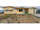 Charming single-story home featuring a light-colored exterior, attached garage, and front yard at 4920 Zodiac Ave, Holiday, FL 34690