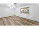 A bright living room with new vinyl floors and a large window at 4920 Zodiac Ave, Holiday, FL 34690