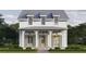Charming two-story home featuring a covered front porch and classic architectural details at 510 35Th N Ave, St Petersburg, FL 33704